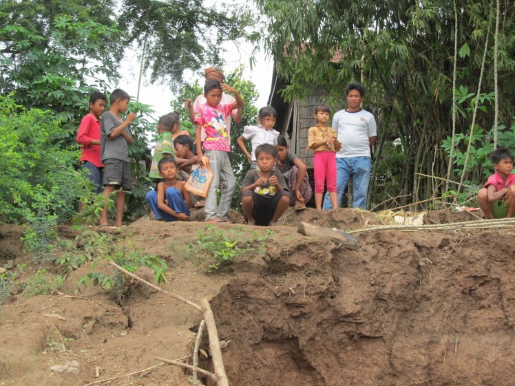 Providing entertainment to local children when our boat breaks down on the way into Cambodia.