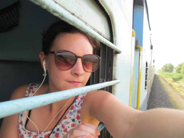 Risky picture-taking in sleeper class.